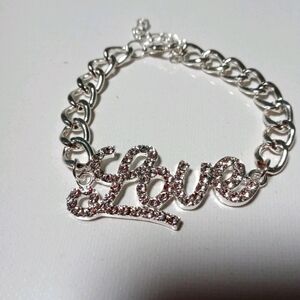 Brand new silver bling love sign bracelet